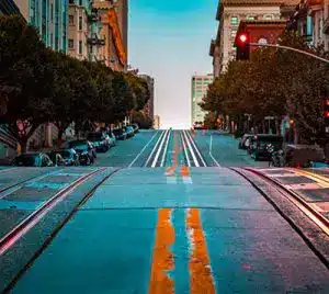 Street going up hill with trolly tracks